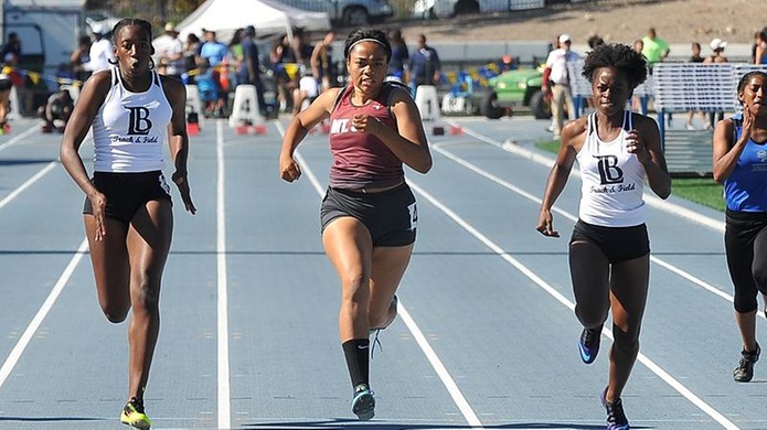 Sherrice Pelle (left) was third while Breonna James (right) finished second in their heat of the 100 meters at the Arnie Robinson Invitational. (Photo by Dean Lofgren)